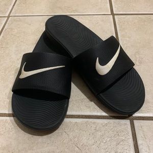 Black Nike slides